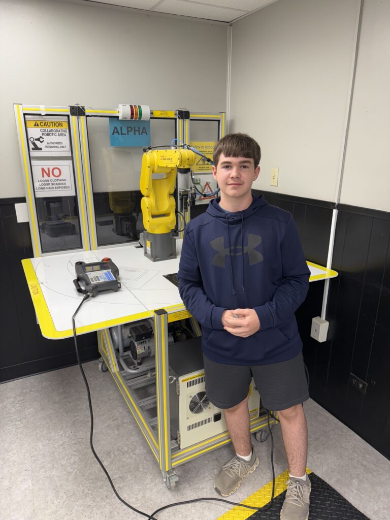 FCRC student Colt Jones poses with a robot
